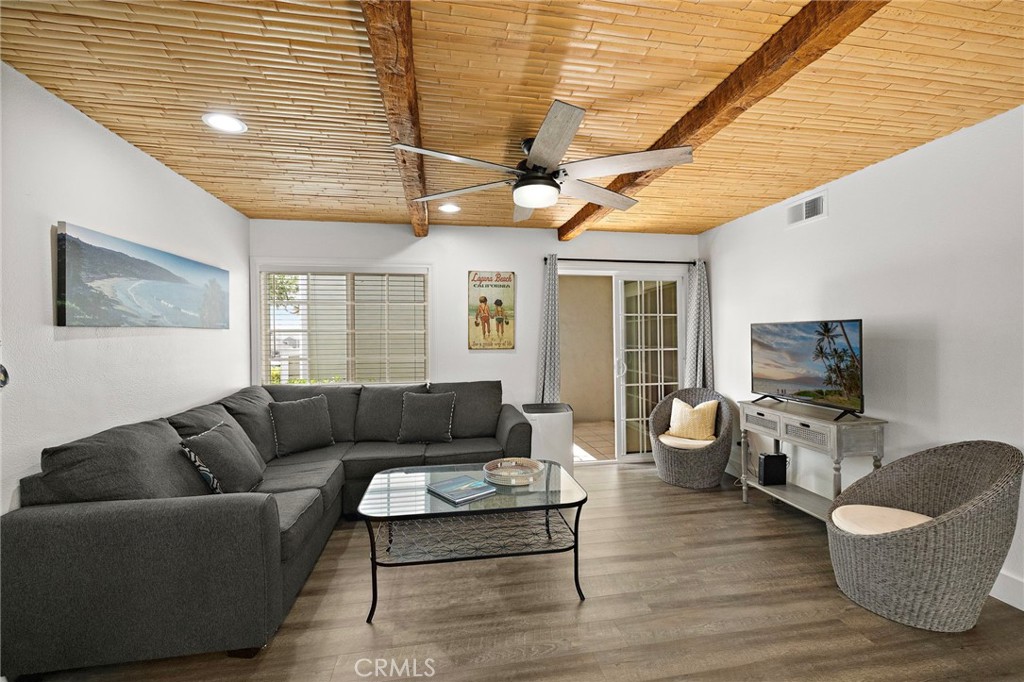 34044 Selva Road, Unit 150 Dana Point, CA 92629 - Photo 6 of 38 a living room with furniture and a flat screen tv