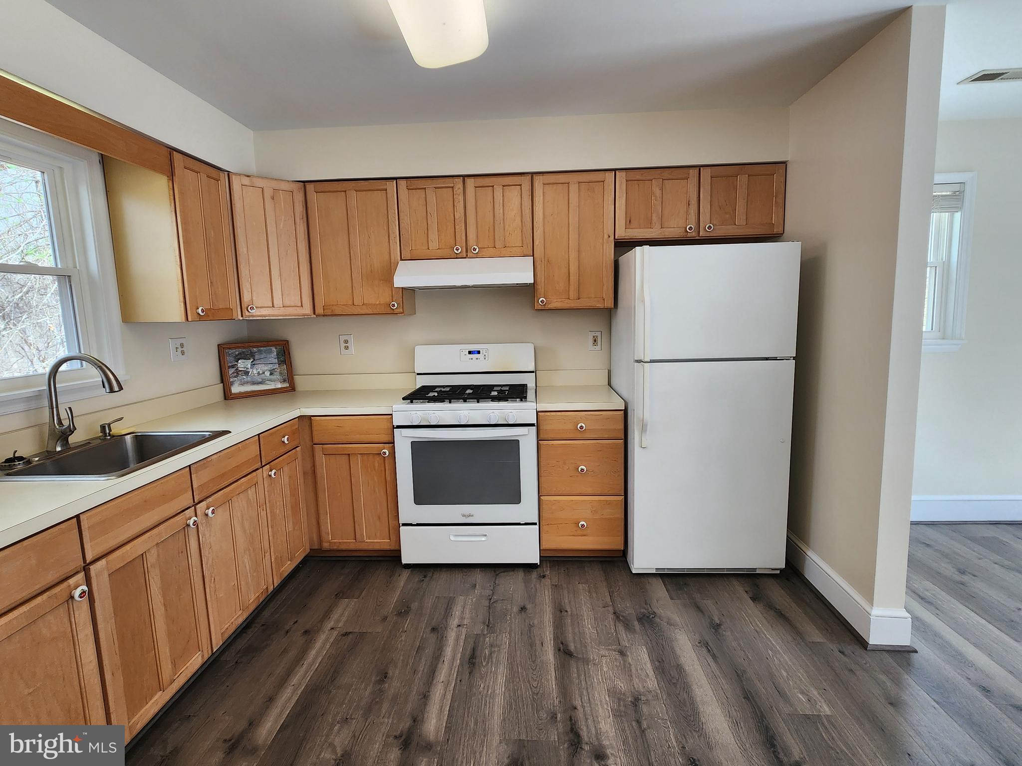 156 Dry Run Court Front Royal, VA 22630 - Photo 6 of 34 a kitchen with a sink a refrigerator and cabinets