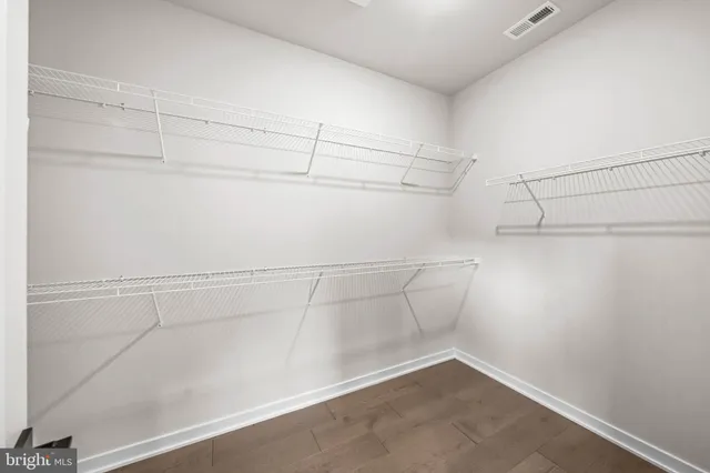 a view of a room with racks on the wall