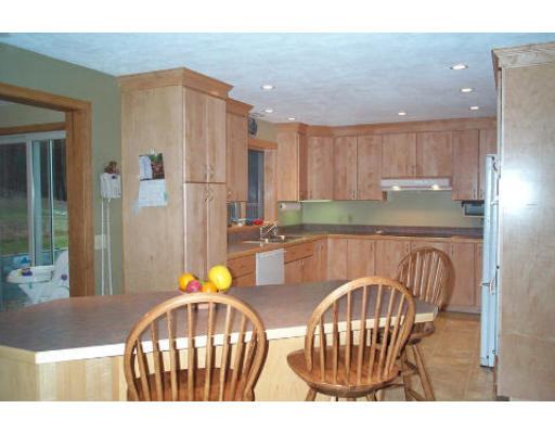 43 Breakneck Road Sturbridge, MA 01566 - Photo 3 of 6 a view of kitchen with kitchen island dining table and chairs