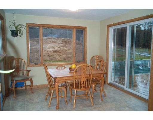 43 Breakneck Road Sturbridge, MA 01566 - Photo 4 of 6 a dining room with furniture and wooden floor