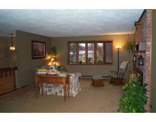 43 Breakneck Road Sturbridge, MA 01566 - Photo 5 of 6 a living room with furniture and a large window