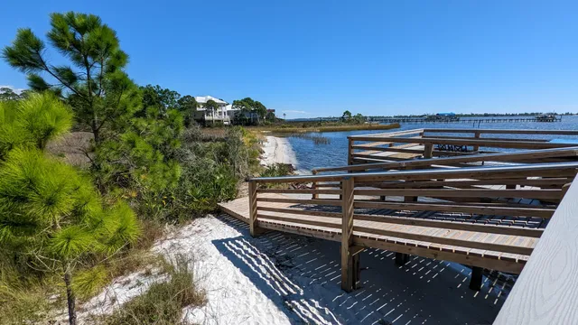 a view of a roof deck with wooden floor and fence