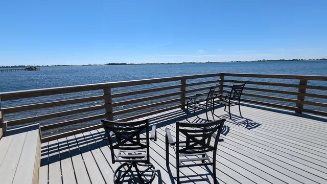 a view of a terrace with wooden floor and city view