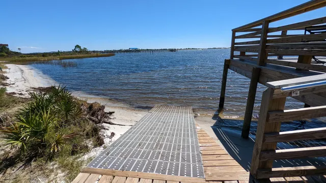 a terrace with outdoor seating and wooden floor