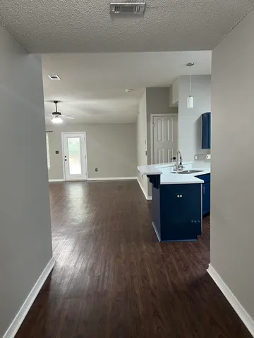 a view of a kitchen and a sink