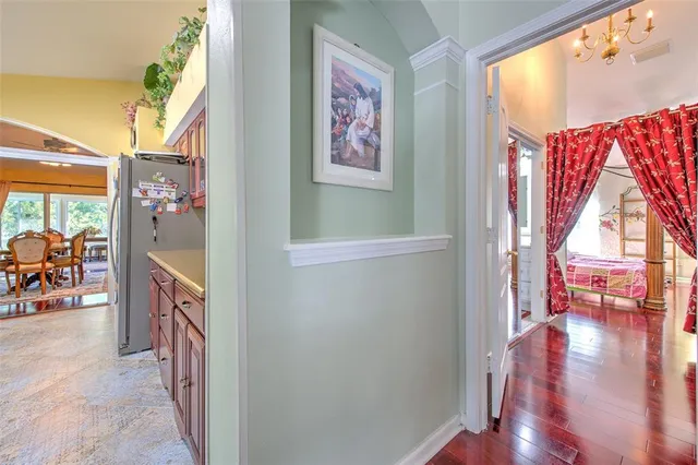 a view of an entryway with wooden floor