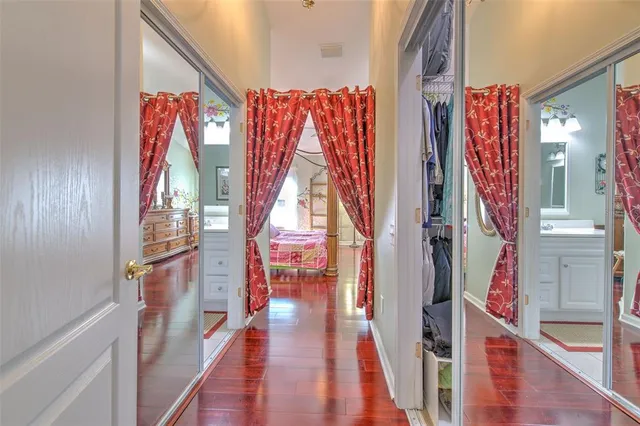 a view of a hallway with paintings on the walls