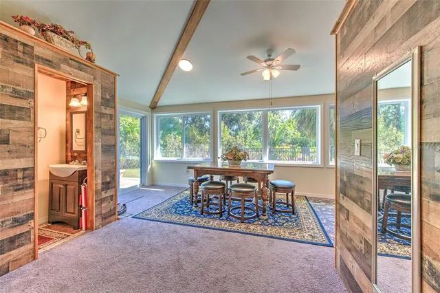 a room with furniture and a large window