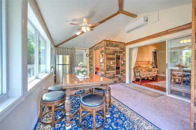 a bed room with a bed and a chair