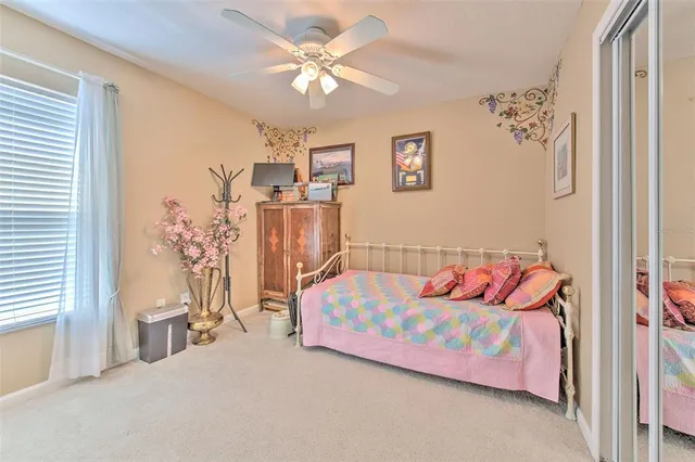 a view of kitchen with stainless steel appliances granite countertop a refrigerator dining table and chairs