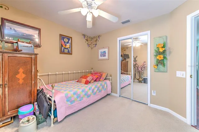 a dining room with furniture and a floor to ceiling window