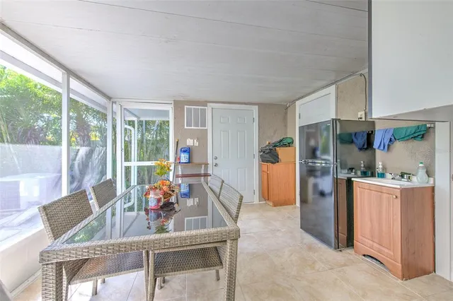 a front view of multiple houses with yard and green space