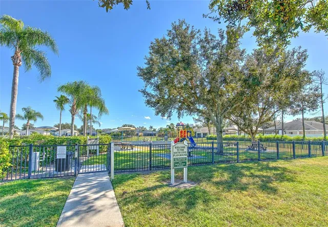a view of a house with pool and chairs
