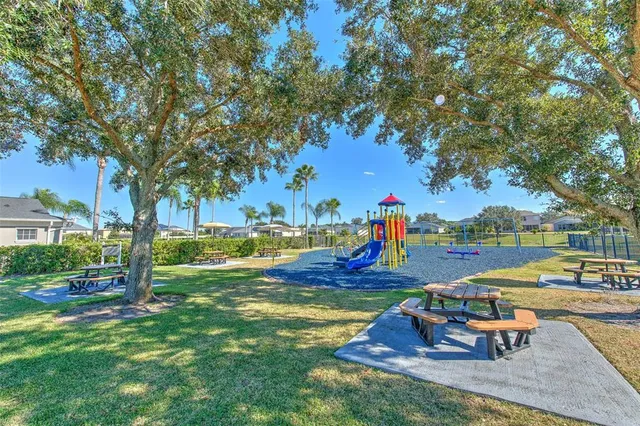 a view of a swimming pool with a patio and a garden