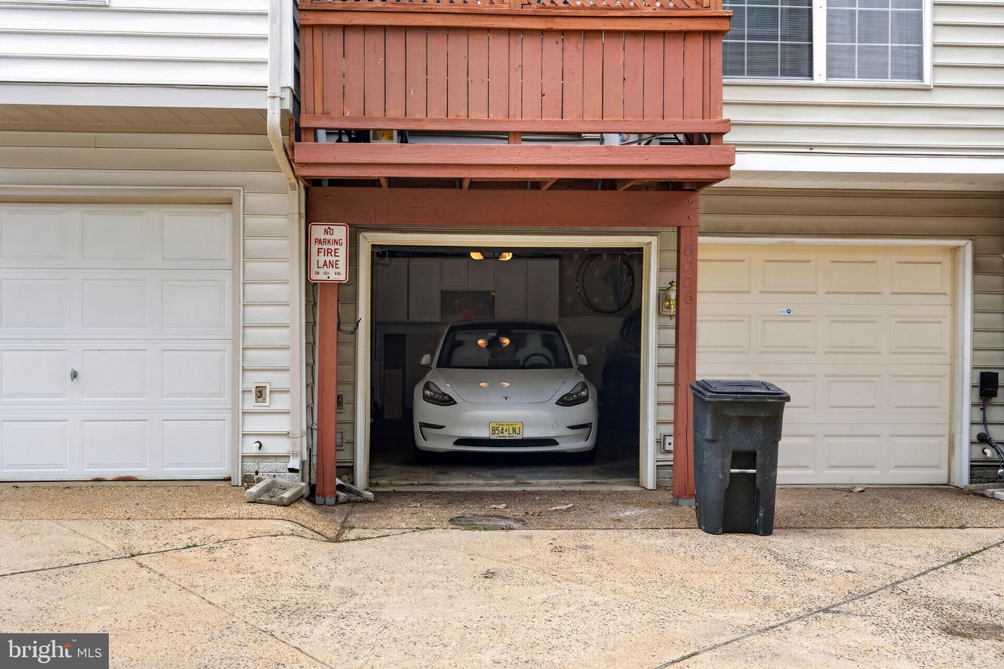 6006 Lincolnia Road Alexandria, VA 22312 - Photo 42 of 42 Modern garage with sleek vehicle.