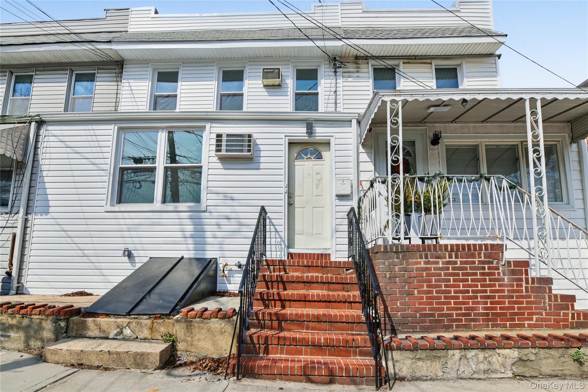 79-47 68th Road Queens, NY 11379 - Photo 1 of 29 a view of a house with wooden deck