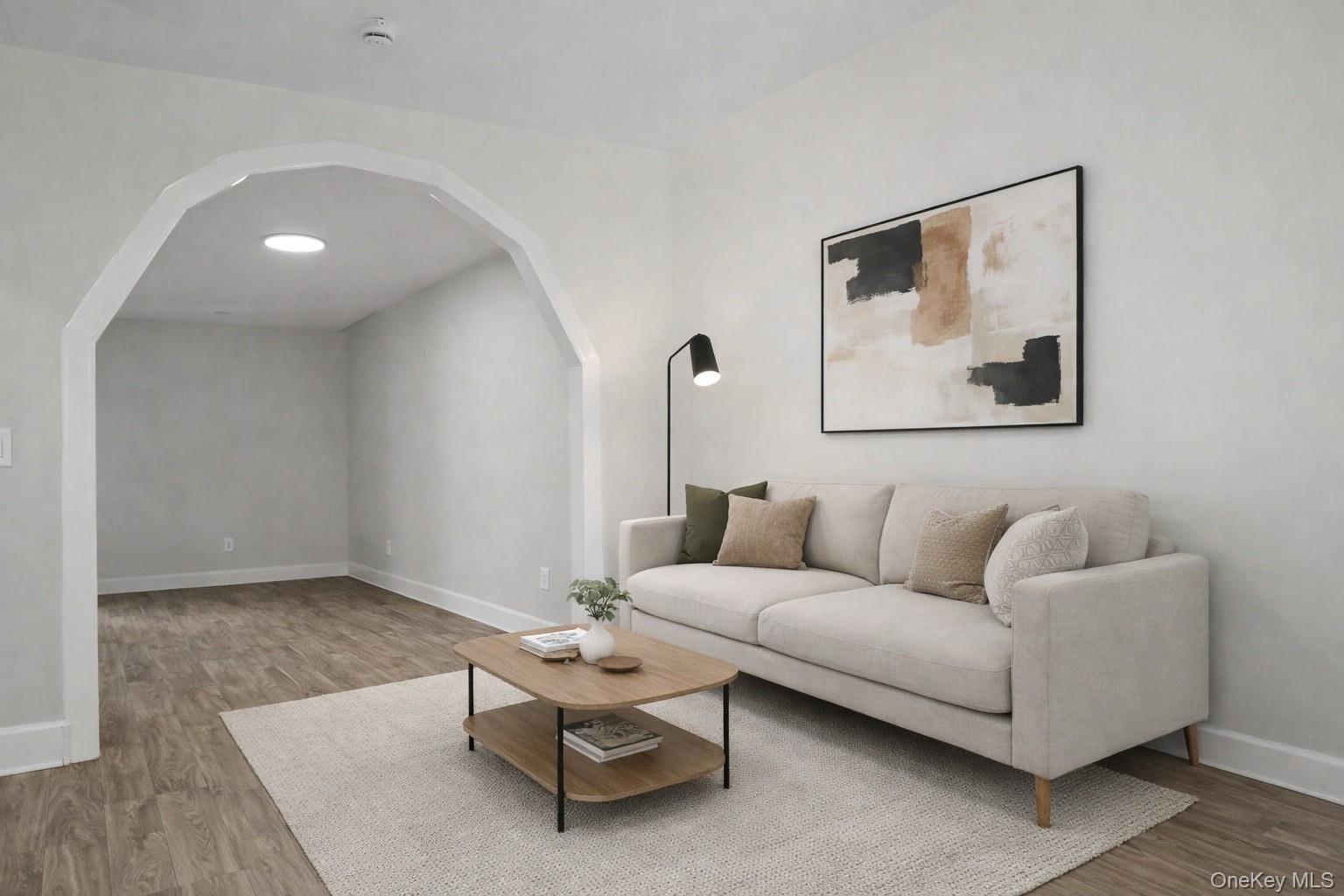 79-47 68th Road Queens, NY 11379 - Photo 17 of 29 a living room with furniture and a painting