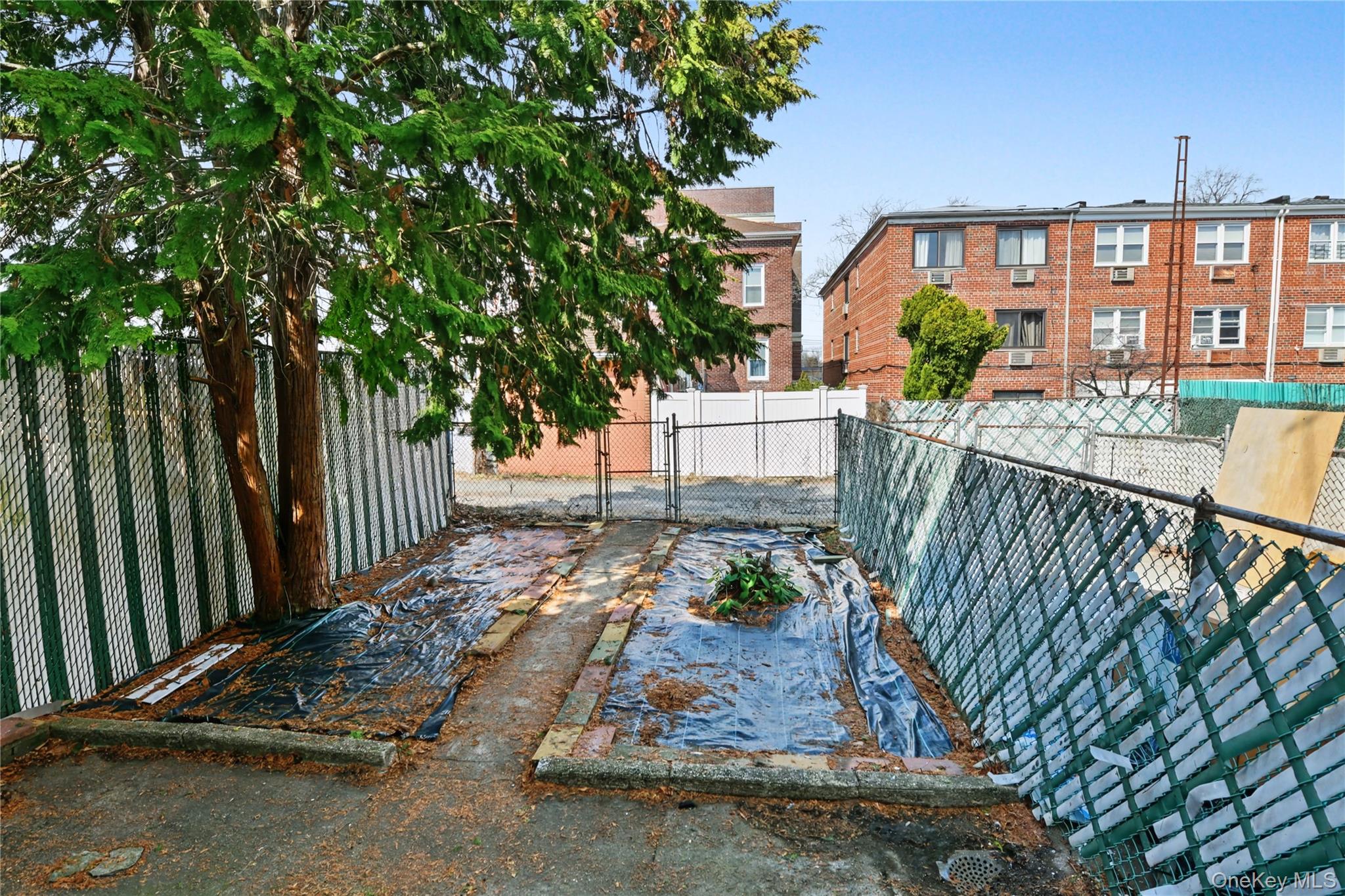 79-47 68th Road Queens, NY 11379 - Photo 29 of 29 a view of a porch with a bench