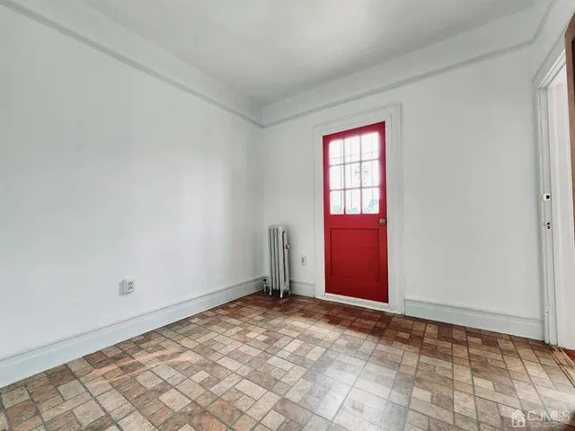 a view of an empty room and window
