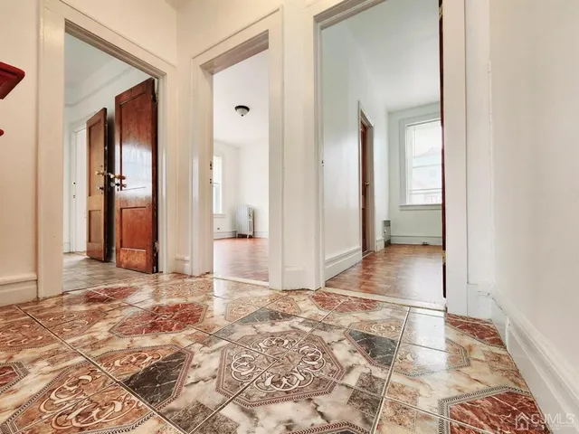 a view of a bathroom with sink and shower