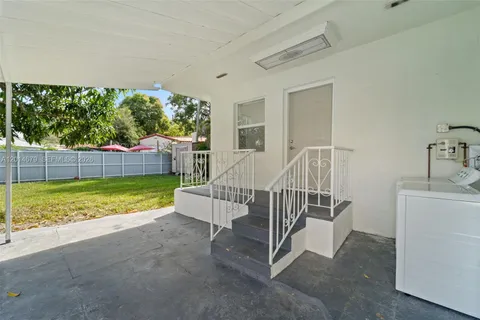 a view of backyard with trampoline