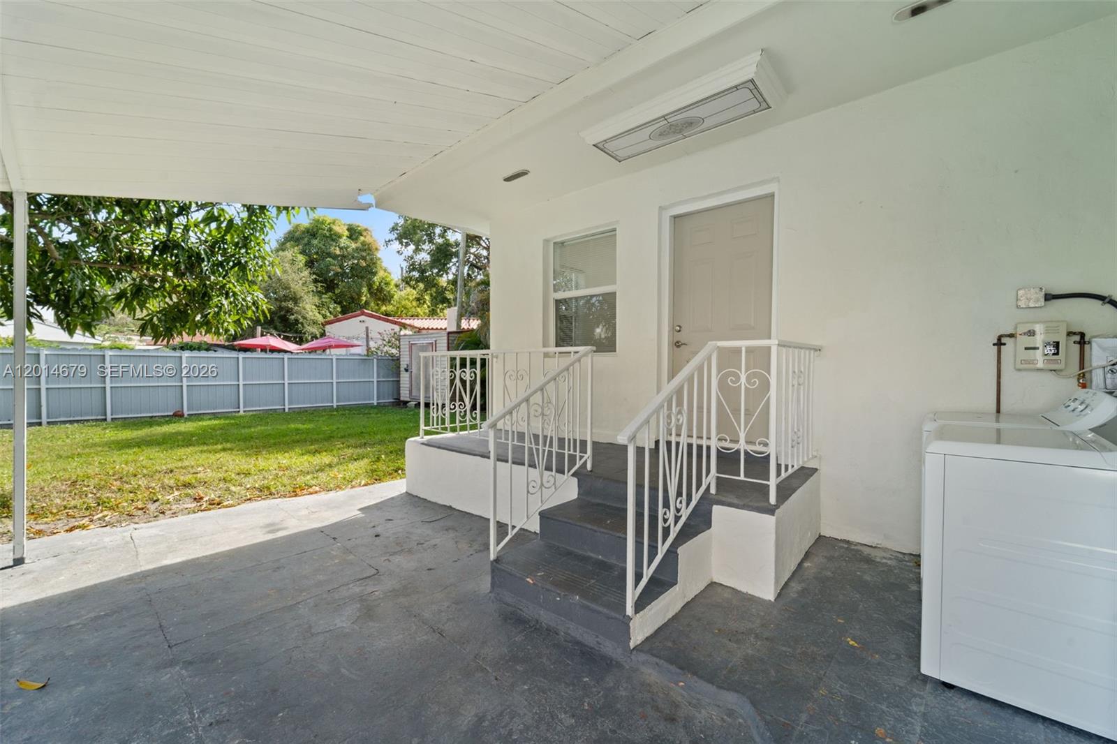 255 Beacom Boulevard, Unit DOWNSTAIRS Miami, FL 33135 - Photo 14 of 36 a view of backyard with trampoline