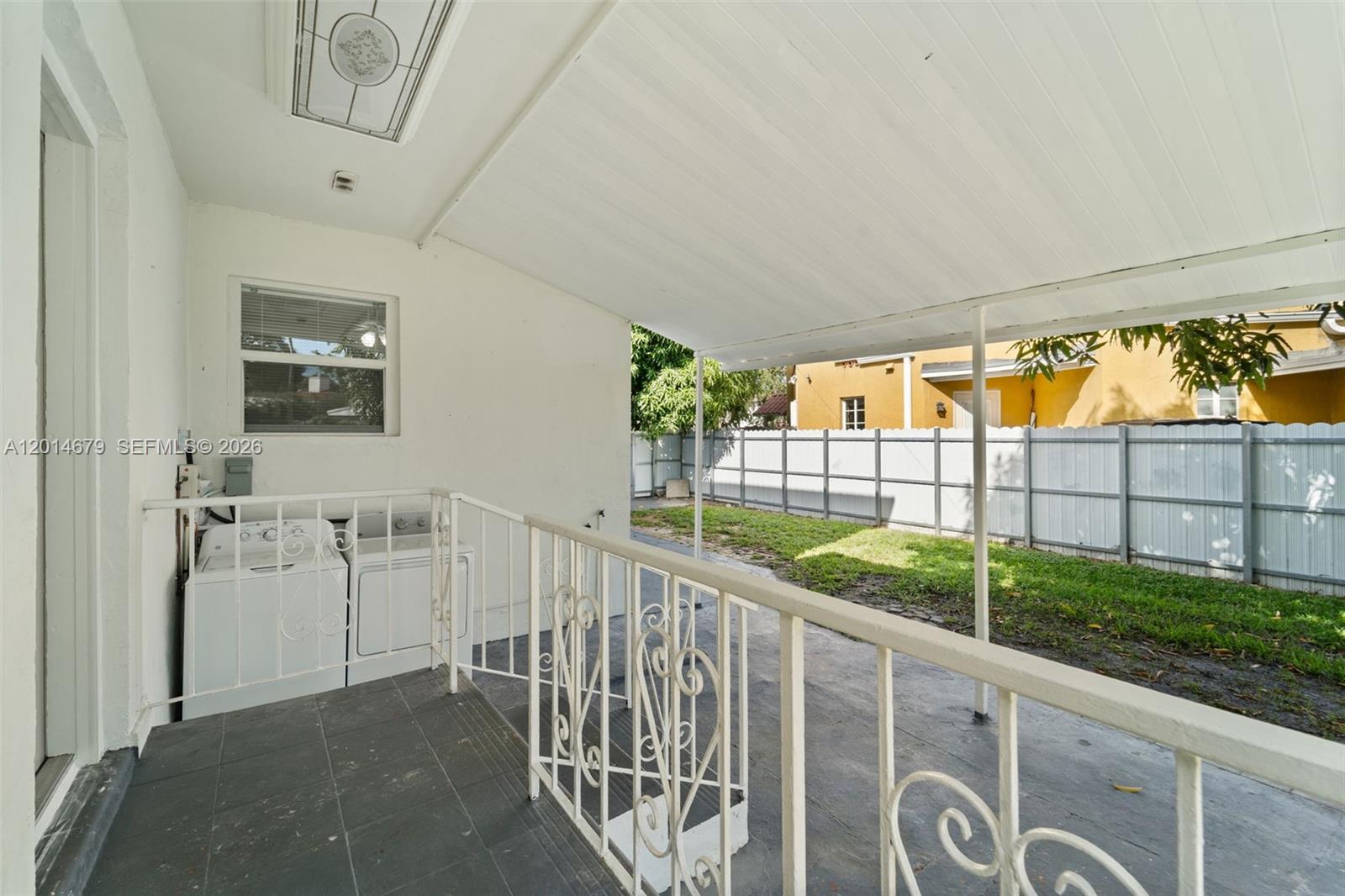 255 Beacom Boulevard, Unit DOWNSTAIRS Miami, FL 33135 - Photo 16 of 36 a view of a porch