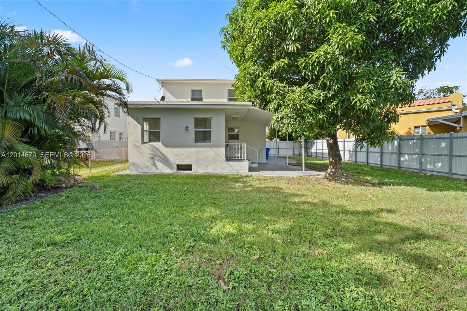 255 Beacom Boulevard, Unit DOWNSTAIRS Miami, FL 33135 - Photo 18 of 36 a front view of house with yard