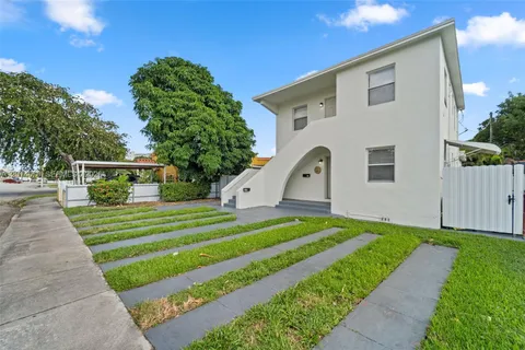 a front view of a house with a yard