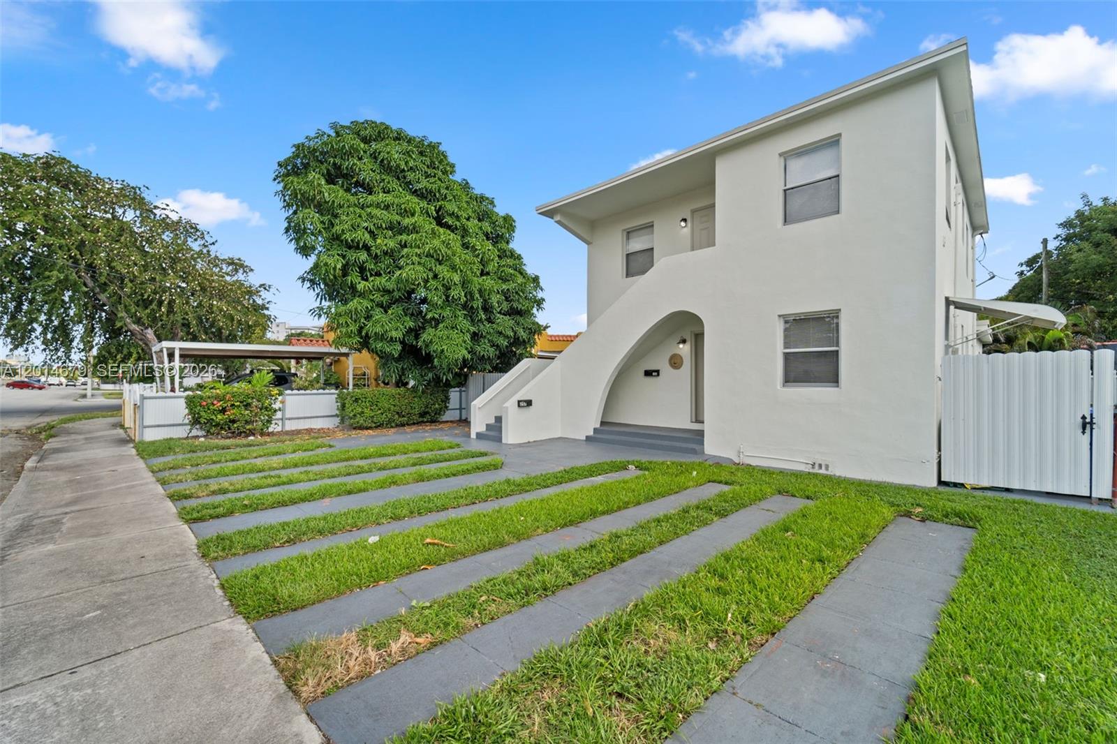 255 Beacom Boulevard, Unit DOWNSTAIRS Miami, FL 33135 - Photo 36 of 36 a front view of a house with a yard