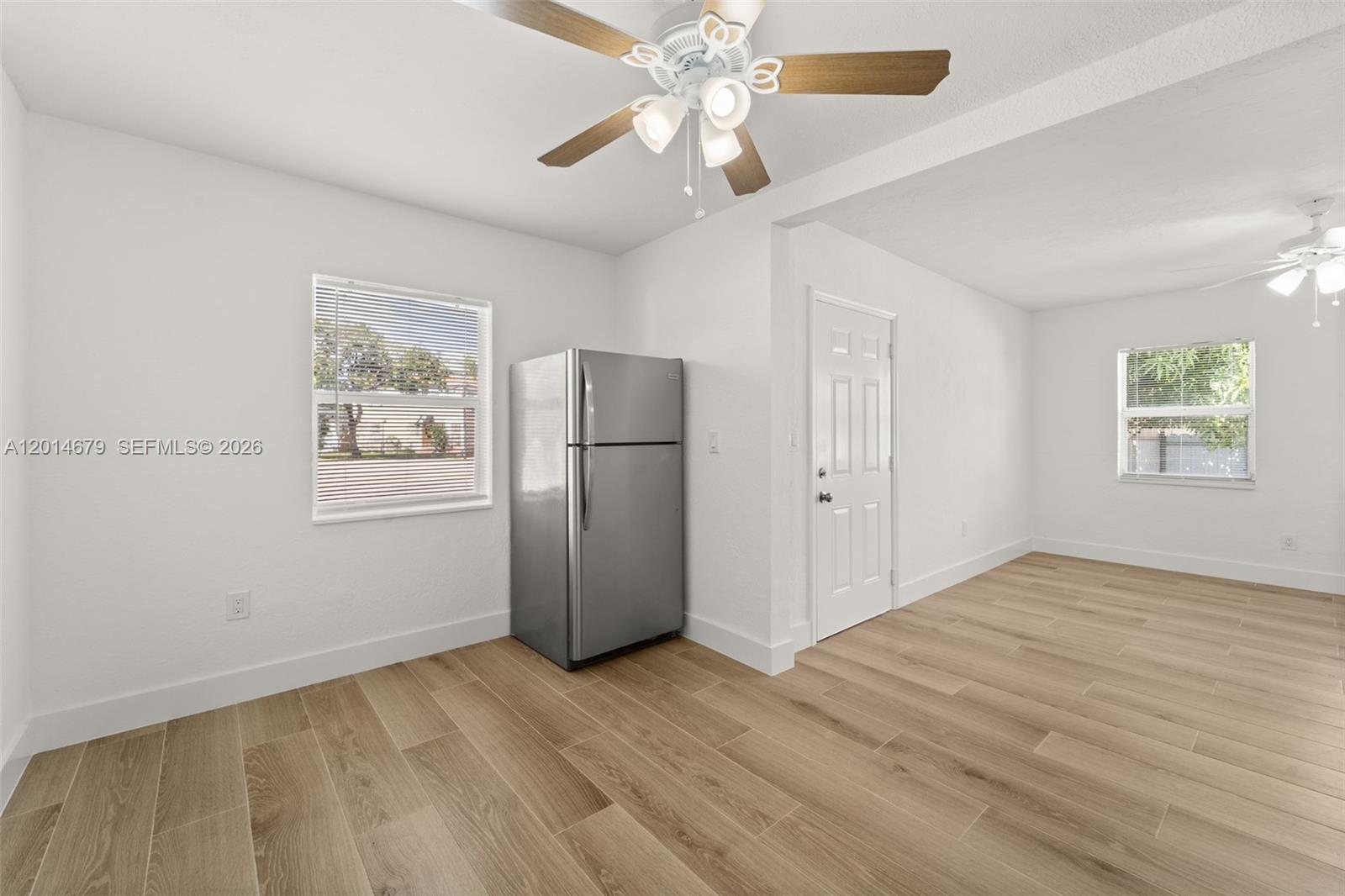 255 Beacom Boulevard, Unit DOWNSTAIRS Miami, FL 33135 - Photo 5 of 36 a view of an empty room with a window