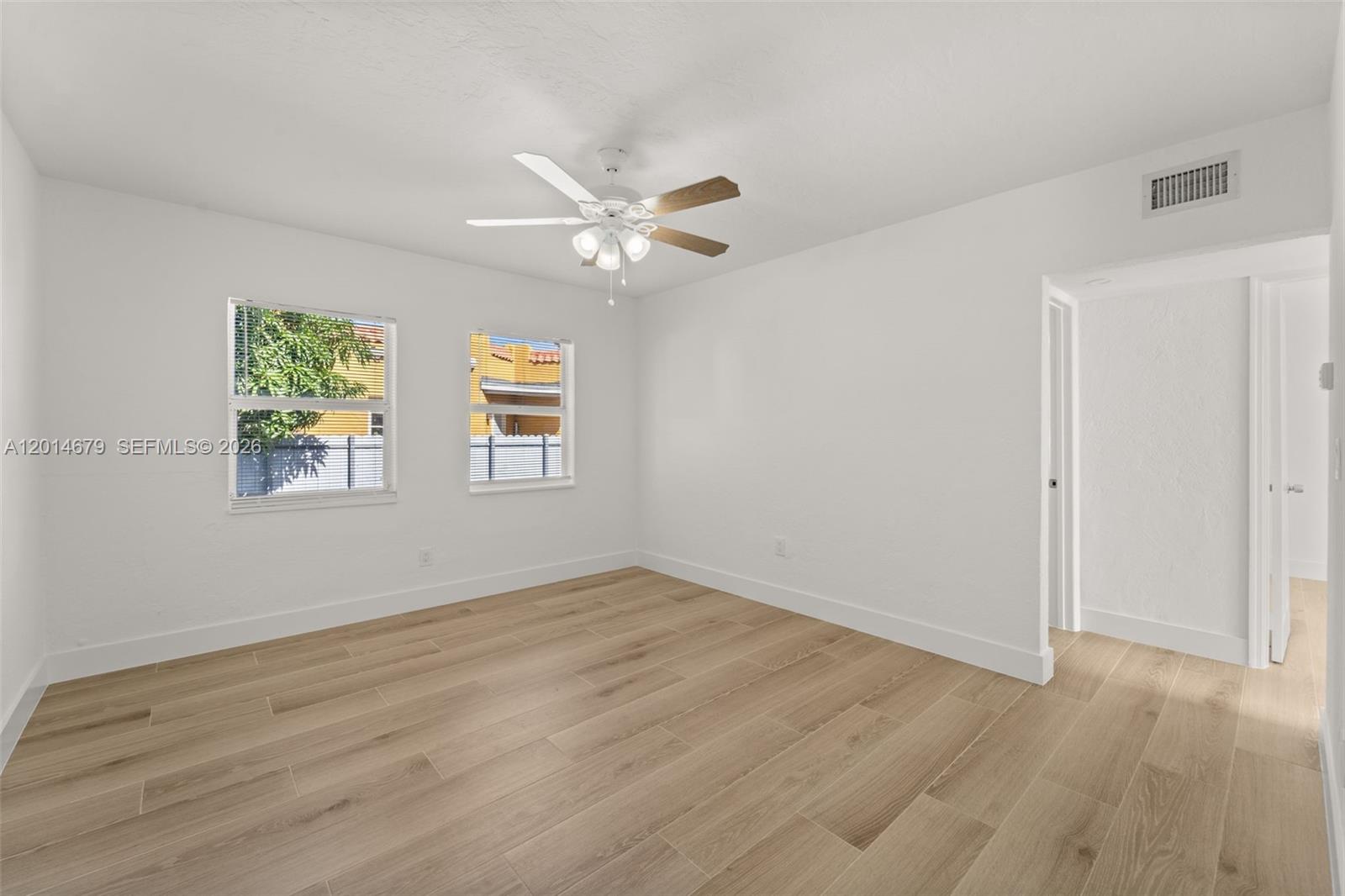 255 Beacom Boulevard, Unit DOWNSTAIRS Miami, FL 33135 - Photo 7 of 36 a view of an empty room with a window