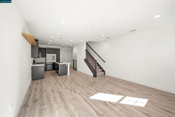 a view of kitchen with wooden floor