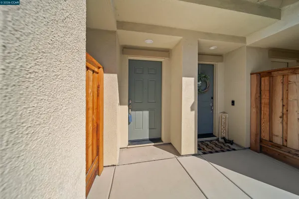 a view of a hallway with wooden cabinets