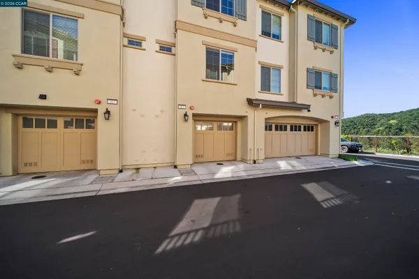 a front view of a building with a road