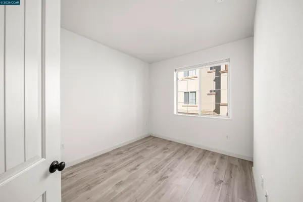 a view of a room that has a window in it