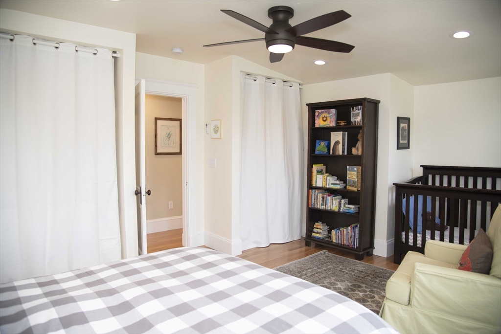 3 Chester Road, Unit 3 Belmont, MA 02478 - Photo 24 of 40 a spacious bedroom with a bed closet and a window