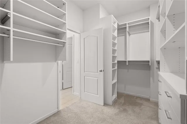 a view of an empty walk in closet