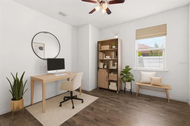a work room with furniture and wooden floor