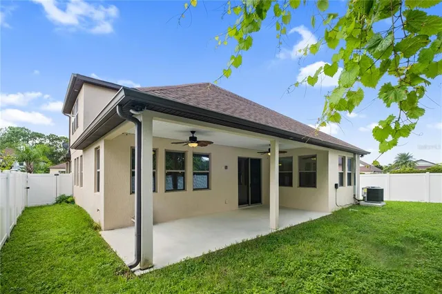 a view of an house with backyard space and garden