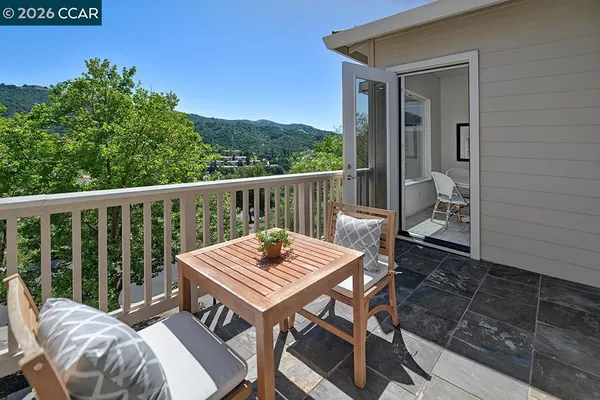 a view of a dinning table and chairs in patio