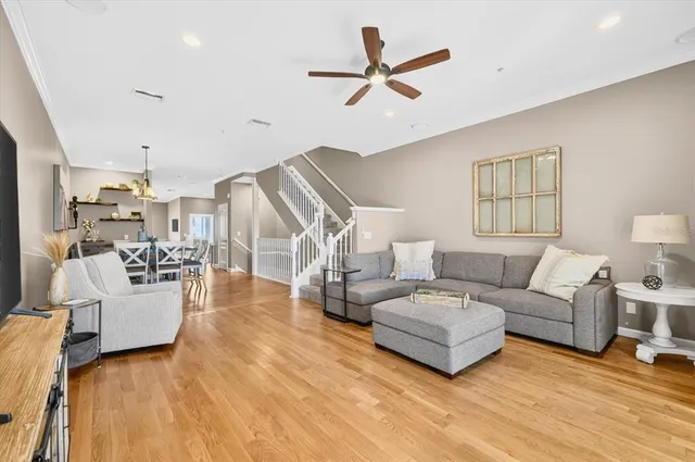 a kitchen with a refrigerator sink and cabinets