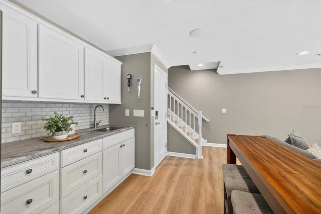 a bathroom with a granite countertop sink mirror and double