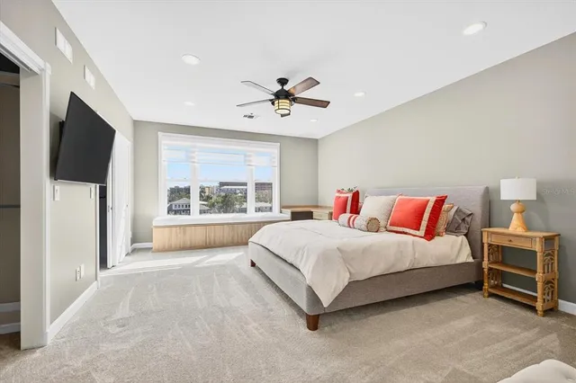 a bathroom with a granite countertop sink a toilet and a mirror