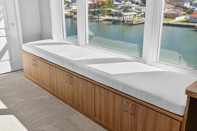 a bathroom with double vanity sinks a vanity a lamp and a mirror