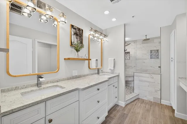 a view of an empty room with a window and a flat screen tv