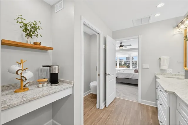 a view of a room with wooden floor