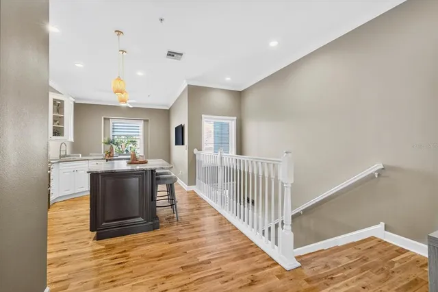a bathroom with a granite countertop sink and a toilet