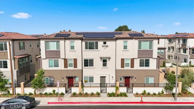 a front view of residential houses with street